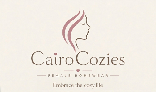 Cairo Cozies Female Homewear logo on a light cream background, featuring a stylized profile of a woman with pink hair and the text 'Embrace the cozy life'.